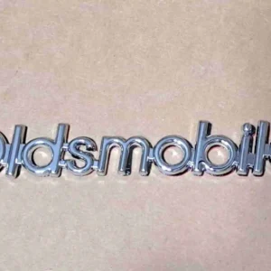 1986-1988 Cutlass Header Panel "Oldsmobile" Emblem